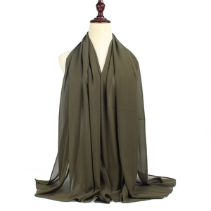 Close-up of elegant army green bubble chiffon hijab showing soft drape and light texture