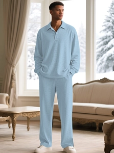 Detail view of light blue waffle knit texture on a men's long sleeve polo set