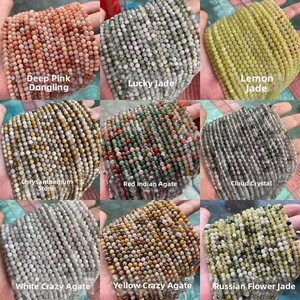 Close-up of nine different natural stone beaded bracelets in various colors and textures
