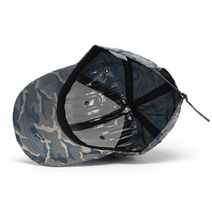 Detail view of camouflage baseball cap interior with sweatband and adjustable metal buckle