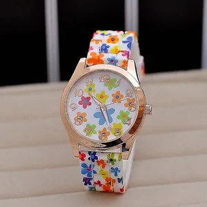 Detail view of floral print Geneva quartz watch with rose gold bezel and silicone strap