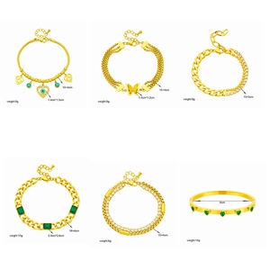 Set of gold-plated butterfly and heart charm bracelets with crystal accents