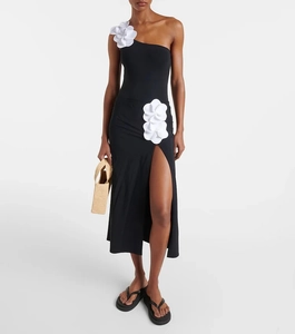 Detail of 3D white floral appliqué on a chic black one-shoulder asymmetric swimsuit