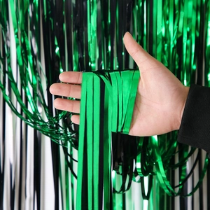 Green and black foil fringe curtain for St. Patrick's Day party backdrop decoration