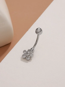 Detailed close-up of a silver flower navel ring with sparkling zircon stones and round ball top