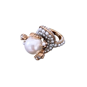 Vintage gold flower ring featuring a large center pearl surrounded by miniature white beads