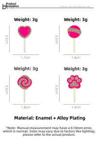 Detailed view of pink enamel cat paw and lollipop brooches with rhinestone accents