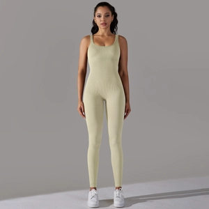 Close-up of light green ribbed seamless yoga bodysuit showing textured fabric and slim fit
