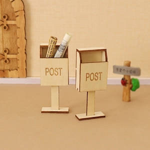Miniature wooden Christmas post box with POST engraving and tiny newspaper props