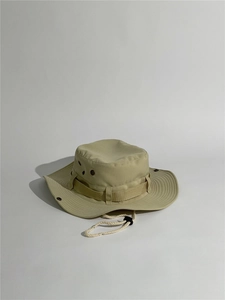 Detail view of khaki outdoor sun hat with wide brim and adjustable chin strap