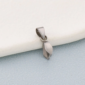 Macro shot of stainless steel pinch bails for DIY jewelry making and pendant connectors