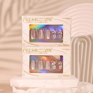 Short square cat eye press-on nails in mauve pink with sparkling rhinestones and glitter