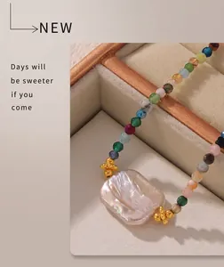 Close-up of baroque pearl necklace with colorful beads in a luxury jewelry box