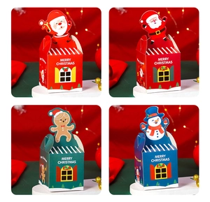 Detailed views of various Christmas themed house-shaped paper gift boxes with handles