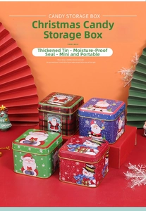 Close-up of assorted festive Christmas tin storage boxes with Santa and snowman patterns