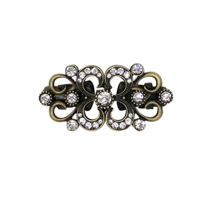 Elegant vintage rhinestone sweater clip in bronze finish with ornate hollowed-out design