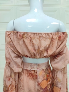 Detailed back view of pink floral chiffon off-shoulder top and long skirt set