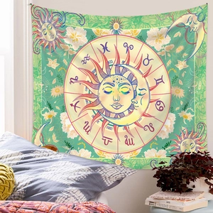 Detail of bohemian sun and moon tapestry with zodiac signs hung in a cozy bedroom