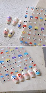 Detail showing colorful cartoon facial expression nail art stickers on a transparent sheet
