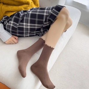Brown knit cotton socks for women featuring elegant ruffled edges and vertical ribbed texture