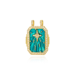 Detailed view of a vintage gold-plated rectangular tarot pendant with turquoise enamel star
