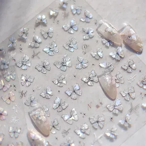 Macro shot of MS 571 butterfly nail stickers with laser glitter effect and starry elements