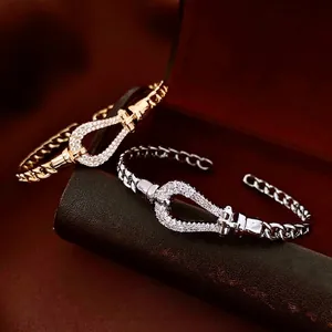18K gold plated teardrop open bangle with pavé zircons in gold and silver finish