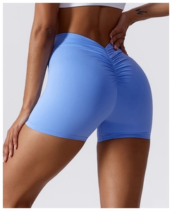 Close-up of high-waist blue yoga shorts featuring a scrunch butt design for lifting