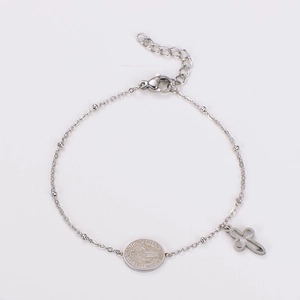 Detail of silver stainless steel chain bracelet with hollow cross and religious medal