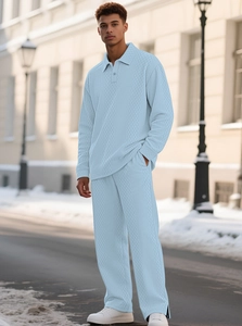 Detail shot of men's light blue knitted polo set showing the textured fabric and casual fit