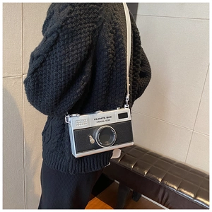 Fashionable camera-shaped crossbody bag in silver and black patchwork with thin strap