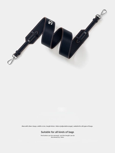Detail of 4.1cm wide navy leather strap with white stitching and adjustable length