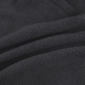 Macro shot of high-density black fleece fabric showing warm and breathable texture