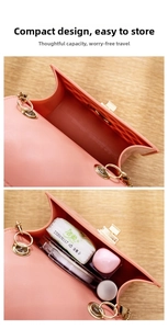 Detail showing the internal storage capacity of a pink jelly bag with gold hardware