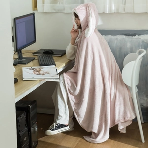 Detail of pink fleece hooded shawl with cute rabbit ears design and plush texture