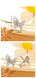 Macro detail of butterfly crystal stud earring with 1.21x1.25cm size measurements