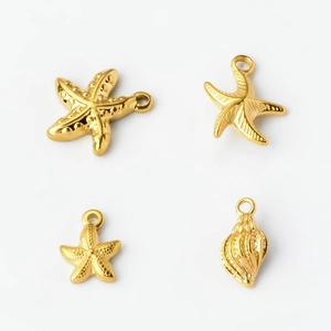 Detailed set of four gold stainless steel starfish and seashell pendants for DIY jewelry