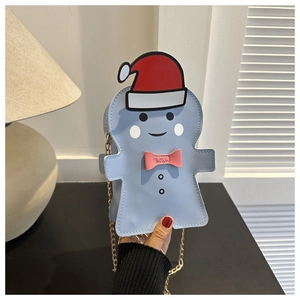 Detail of light blue gingerbread man crossbody bag with gold chain and festive hat