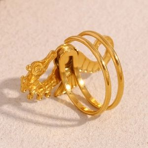 Detailed macro view of gold-plated seahorse ring featuring double band craftsmanship
