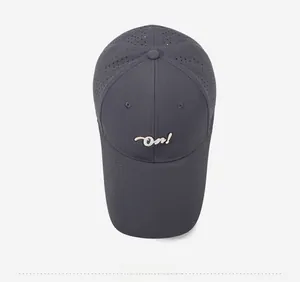 Detailed top view of dark grey baseball cap featuring laser-cut ventilation and On! embroidery