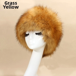 Detailed texture of straw yellow faux fox fur on Russian style warm winter hat