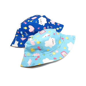 Detail of cartoon bear and cloud patterns on cotton canvas kids bucket sun hats