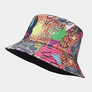 Detail of double-sided graffiti bucket hat featuring hip-hop cassette and boombox prints