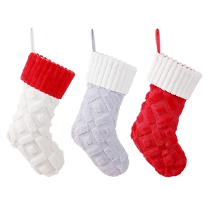 Three-piece diamond knit Christmas stockings with plush faux fur trim in red, grey, and white