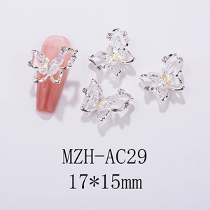 Detail of 17x15mm laser aurora butterfly nail charm with silver frame and mini pearls
