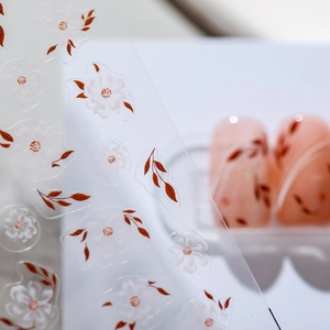 Elegant thin nail art stickers featuring translucent white flowers and reddish leaves