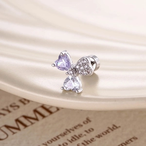 Elegant silver butterfly stud earring with purple and clear zircon stones in macro view