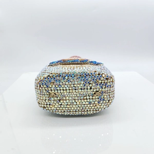 Detailed bottom view of a champagne bottle clutch bag with sparkling silver rhinestones