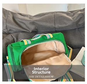 Detail showing the spacious interior and striped handles of this green sports gym bag