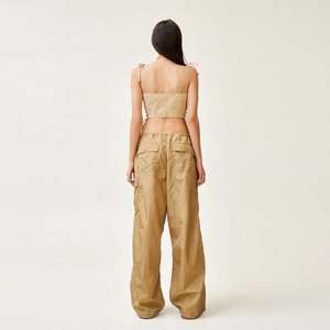 Back view of khaki cargo pants and matching cropped vest set with premium fabric texture